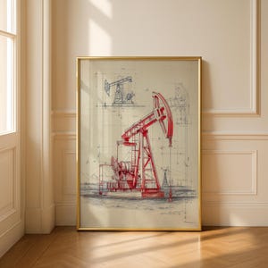 May include: Framed print featuring a red and gray illustration of an oil pump jack. The artwork includes detailed sketches and a blueprint style, set against a beige background. The print is encased in a gold frame, adding a touch of elegance.