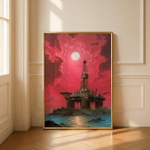 Pode incluir: Uma impressão emoldurada com uma plataforma de petróleo sob um céu vermelho dramático com uma lua cheia. A plataforma está situada numa ilha rochosa em água azul. A obra de arte tem uma moldura dourada e é exibida num chão de madeira.