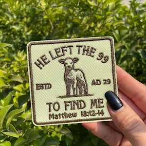 May include: A square patch with a light green background and brown border. The patch features a lamb illustration and the text "HE LEFT THE 99" and "TO FIND ME" with the reference Matthew 18:12-14.