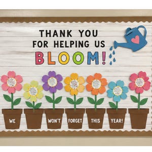 May include: A classroom bulletin board with the message "THANK YOU FOR HELPING US BLOOM!" and colorful paper flowers. A blue watering can with a pink heart is pouring water onto the flowers. The flowers are in brown pots with the words "WE WON'T FORGET THIS YEAR!"