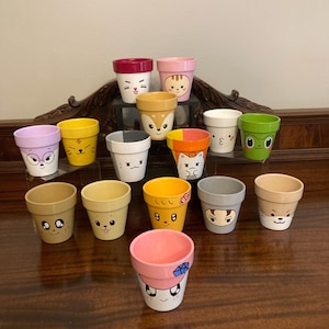 Seventeen Miniteen Hand Painted Clay Pots