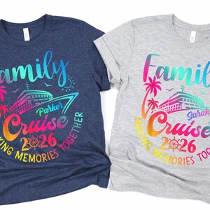 May include: Two t-shirts, one navy blue and one grey, with a colourful graphic. The graphic includes the word "Family" and "Cruise 2026" with a cruise ship, palm trees, and the text "Making Memories Together."