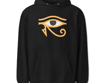 May include: A black hooded sweatshirt featuring a large, centered graphic of the Eye of Horus. The design is rendered in shades of yellow, white, and black, depicting the stylized ancient Egyptian symbol with a prominent central pupil and iris.