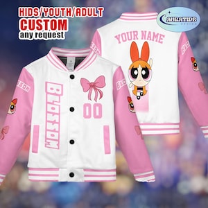 May include: White and pink custom letterman jacket featuring the character Blossom from The Powerpuff Girls. The jacket has the word "BLOSSOM" on the front, a bow graphic, and the number "00". The back of the jacket has the character Blossom and the text "YOUR NAME".