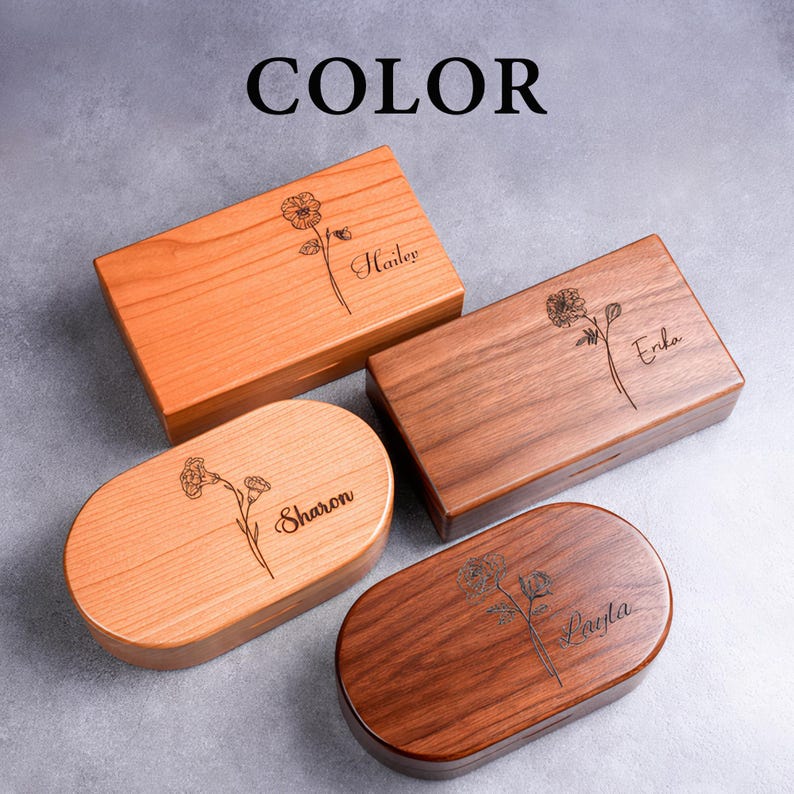 May include: Four wooden boxes in various shapes and wood tones. Each box features a floral design and a name: Hailey, Erika, Sharon, and Layla. The word "COLOR" is printed in black at the top of the image.