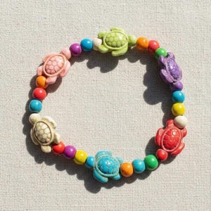 Pulsera elástica con cuentas de tortuga de colores