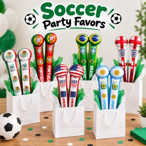 May include: A collection of inflatable cheering sticks in white gift bags, each pair featuring national flags and team names including Mexico, Portugal, Brazil, England, USA, and Argentina. The text Soccer Party Favors appears above.