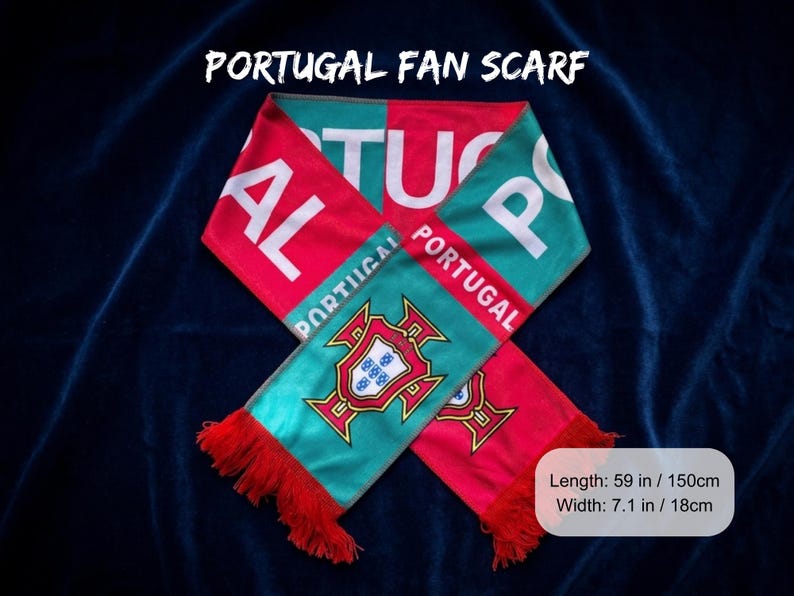 May include: A Portugal fan scarf with red and teal sections. The scarf has the word "PORTUGAL" in white letters. The scarf has a length of 59 inches and a width of 7.1 inches. The scarf has red fringe.