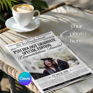 May include: A newspaper-style graduation announcement with the headline "PSYCHOLOGY GRADUATE SPECIAL EDITION Congratulations, Samira!" A photo of a graduate in a cap and gown is featured. A white coffee cup and saucer are on a wicker table.