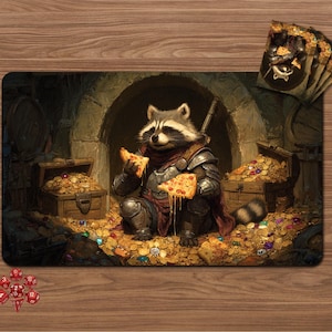 May include: A rectangular playmat featuring a raccoon wearing metal armor and a dark red scarf, sitting in a stone chamber filled with gold coins and treasure chests while holding two slices of pepperoni pizza. A set of red dice is nearby.