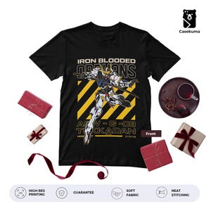 May include: Black t-shirt featuring a detailed illustration of a Gundam robot with the text "IRON BLOODED ORPHANS" and "ASW-G-08 TIKKADAN". The design includes yellow diagonal stripes. The shirt has a soft fabric and high-res printing.