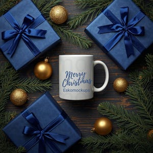 May include: A white coffee mug with the text "Merry Christmas" and "Eskomockups" in blue script is surrounded by blue gift boxes with satin bows, gold ornaments, and evergreen branches on a dark wood surface.