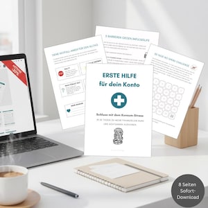 May include: A laptop, coffee cup, and notebook are on a white desk. Several printed pages with German text are scattered around, including one titled "ERSTE HILFE für dein Konto." The laptop screen displays "-20%" in red.