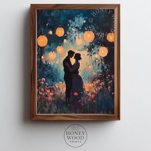 May include: A framed art print featuring a romantic scene of a couple embracing under glowing lanterns. The artwork has a soft, painterly style with a color palette of blues, oranges, and greens. The frame is made of wood, and the print is from Honey Wood Prints.