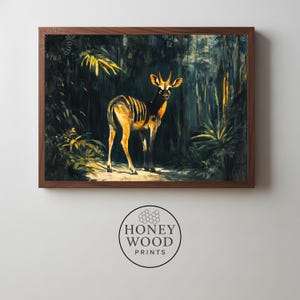 May include: A framed art print depicting a deer in a forest. The deer has gold and black stripes. The artwork is set in a dark brown wooden frame. The print is from Honey Wood Prints. The forest background is dark with hints of yellow.