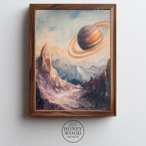 May include: A framed wall art print featuring an oil painting of a rocky, mountainous alien landscape under a pale sky. A large, ringed planet with orange and brown bands dominates the upper right corner, casting a soft glow over the jagged peaks.