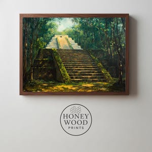 May include: A framed print of a Mayan pyramid in a lush green forest. The pyramid is made of stone and has a long staircase leading to the top. The artwork is surrounded by a dark brown wooden frame.