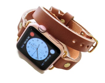 May include: A rose gold Apple Watch with a brown leather band. The watch face displays a stopwatch timer with the text "Total 190:29:38" and "Lap 1 190:29:38".
