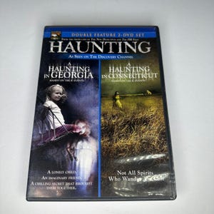 May include: A double feature 2-DVD set titled Haunting, featuring A Haunting in Georgia and A Haunting in Connecticut. The cover art displays a child on a swing on the left and a figure in a field on the right, with text detailing the programs.