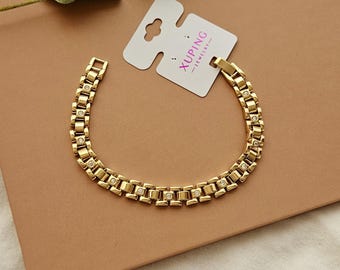 Pulsera de eslabones con aspecto dorado / Circonita cúbica, estilo correa de reloj