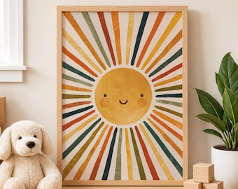 May include: A framed art print depicting a smiling sun with vibrant rays in orange, yellow, green, and blue. The artwork has a retro style and is displayed on a wooden surface. A soft toy dog and a potted plant are also visible in the image.