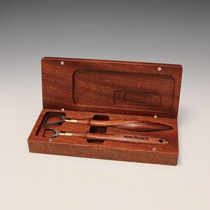 May include: Two wooden handled tools with metal tips, in a wooden box with the text "Hahn Tools" engraved on the tools.