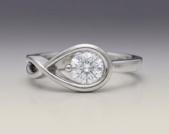 Bague bypass ronde en moissanite 1 carat | Bague de fiançailles torsadée à l'infini en argent sterling