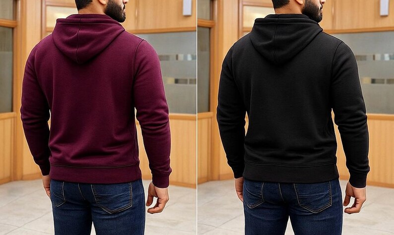 May include: Two hooded sweatshirts, one burgundy and one black, are displayed. Both have long sleeves and a drawstring hood. The sweatshirts are shown from the back, with the models wearing blue jeans. The background is a wooden paneled wall.