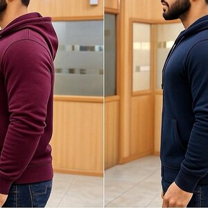 May include: Two hooded sweatshirts, one burgundy and one navy blue, are displayed side-by-side. Both have a front pocket and a drawstring hood. The sweatshirts are made of a soft material and are suitable for casual wear.