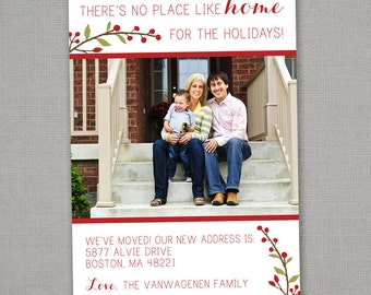 May include: A Christmas card featuring a family of three on their front porch steps. The card reads "There's no place like home for the holidays!" and includes their new address: 5877 Alvie Drive, Boston, MA 48221. The card is signed "Love, The Vanwagenen Family".