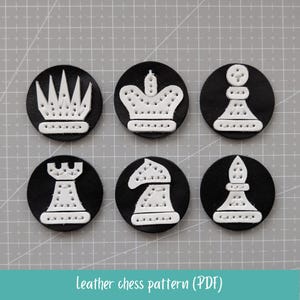 May include: Six black leather chess pieces with white stitched designs, including a queen, king, pawn, rook, knight, and bishop. The pieces are arranged on a gray surface. The text "Leather chess pattern (PDF)" is at the bottom.