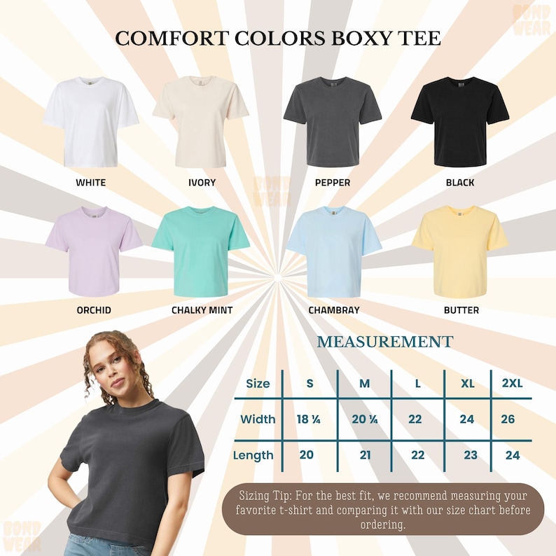 May include: A display of Comfort Colors Boxy Tees in various colors: white, ivory, pepper, black, orchid, chalky mint, chambray, and butter. A measurement chart shows sizes S-2XL with width and length measurements in inches. The text reads "Comfort Colors Boxy Tee."