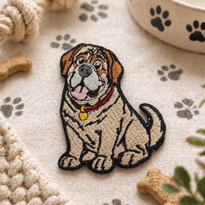 May include: Embroidered patch of a cartoon dog with a red collar and yellow tag. The dog has a tan body, brown ears, and a black outline. The patch is on a light surface with paw print patterns and dog-themed accessories.