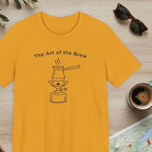 The Art of the Brew Camping Coffee Shirt, Coffee Lover Gift, Minimalist Barista Tee, Line Art Outdoor Graphic Apparel, Nature Lover Present Mustard