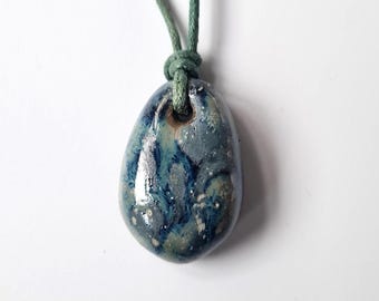 Clay Hand formed pendant. Deep blue glaze. Custom cord colour and length.