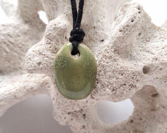 Clay Hand formed pendant. gentle green glaze. Custom cord colour and length.