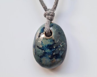 Clay Hand formed pendant. Deep blue glaze. Custom cord colour and length.