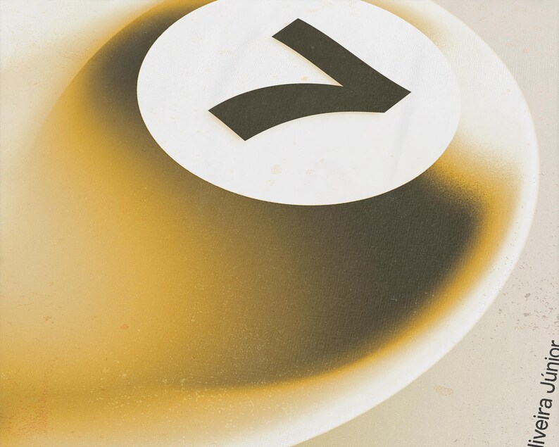 May include: Abstract art piece featuring a white circle with a black number seven. The background has a gradient of yellow and brown tones, with a textured appearance. The artwork has a modern, minimalist aesthetic.