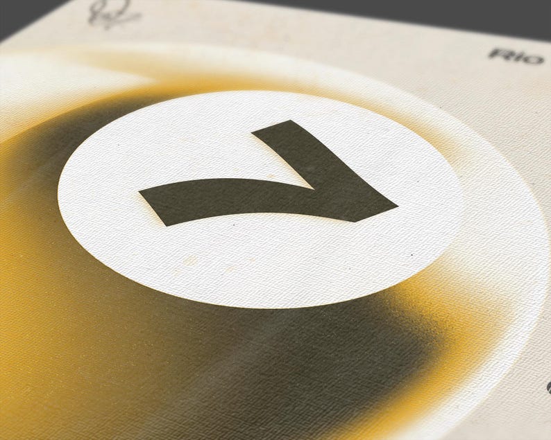 May include: Close-up of a design featuring a large, stylized black number seven inside a white circle. The circle is set against a gradient background of yellow and brown tones. The word "Rio" is visible in the background.