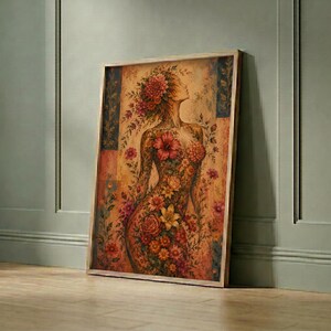 Floral female figure poster in dark wood frame against sage green paneled wall, vintage woman art print, eclectic wall decor