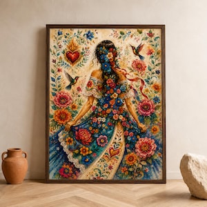 May include: A framed wall art print depicting a person from behind, wearing an off-the-shoulder dress adorned with vibrant floral patterns. The scene features hummingbirds, a central heart emblem, and intricate botanical motifs in rich colors.