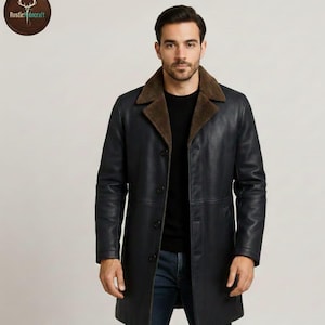 May include: A dark navy blue leather coat with a brown shearling collar. The coat is buttoned up and worn by a person. The coat has a classic, tailored design. The Rustic Hidecraft logo is in the upper left corner.