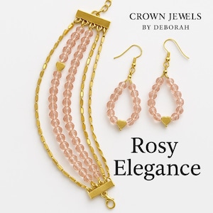 May include: A gold-toned bracelet and matching earrings set. The bracelet features multiple strands of pink beads and gold chain links. The earrings are teardrop-shaped with pink beads and gold heart accents. The text "Crown Jewels by Deborah" and "Rosy Elegance" are visible.
