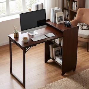 May include: A dark brown wooden desk featuring a flat work surface, a raised upper shelf, and integrated side shelving. The desk holds a computer monitor, a white keyboard, a small succulent in a gold pot, a ceramic mug, and a vintage camera.