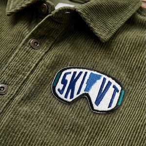 May include: A set of three ceramic mugs with a speckled, matte finish. The mugs are in shades of cream, light gray, and dark gray. Each mug has a simple, minimalist design, perfect for coffee or tea.