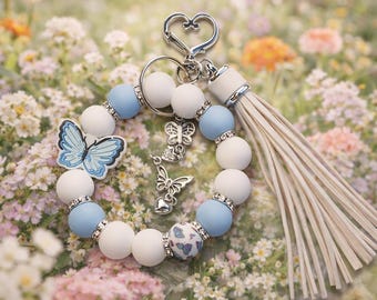 Llavero de mariposa azul con borla: llavero de cuentas hecho a mano, dije de mariposa para bolso, regalo para ella