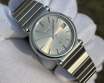Reloj Seiko automático vintage de 17 rubíes y 36 mm / Esfera plateada con efecto rayos de sol / Solo fecha / Brazalete de acero inoxidable / Reloj de vestir clásico