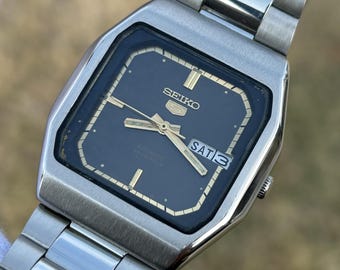 Reloj automático vintage Seiko 5 / Esfera marrón con efecto sol / 23 joyas / Acero inoxidable / Japón