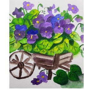 May include: A watercolor painting of a wooden wheelbarrow overflowing with purple and blue violets and green leaves. The wheelbarrow is brown and has a single wheel. The background is white.