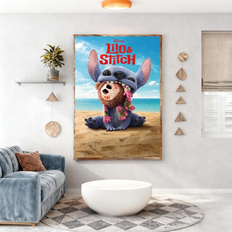May include: A framed poster of Disney's Lilo & Stitch. The image shows Stitch, a blue alien, holding a brown coconut with a pink and green scarf on a sandy beach with a blue ocean and sky background. The title "Lilo & Stitch" is displayed at the top.
